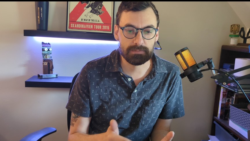 Matt Robinson recording a marketing training video at his desk